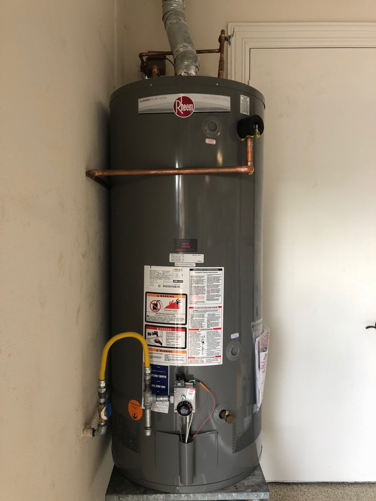 Rheem 75-gallon natural gas storage water heater photographed by Water Heating Experts at a BallenIsles-area job