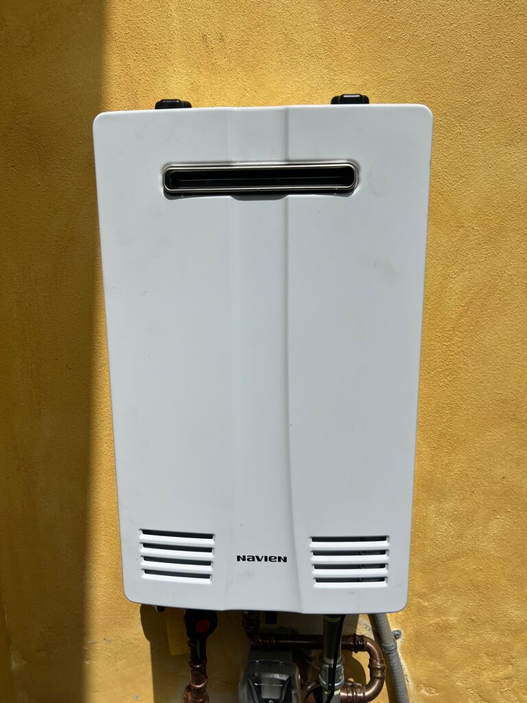 Navien outdoor tankless hot water heater from a Water Heating Experts installation