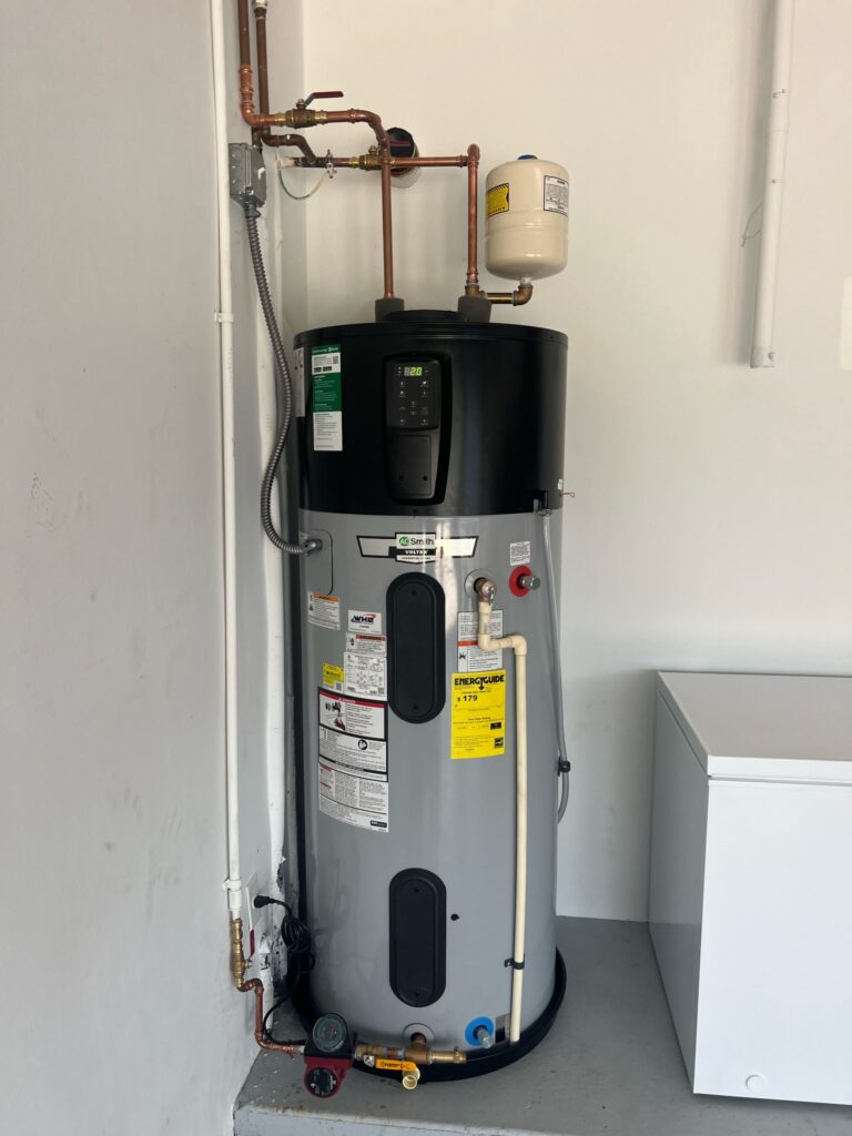 A.O. Smith Voltex hybrid water heater installed by WHE in the Loxahatchee area with copper piping and an expansion tank