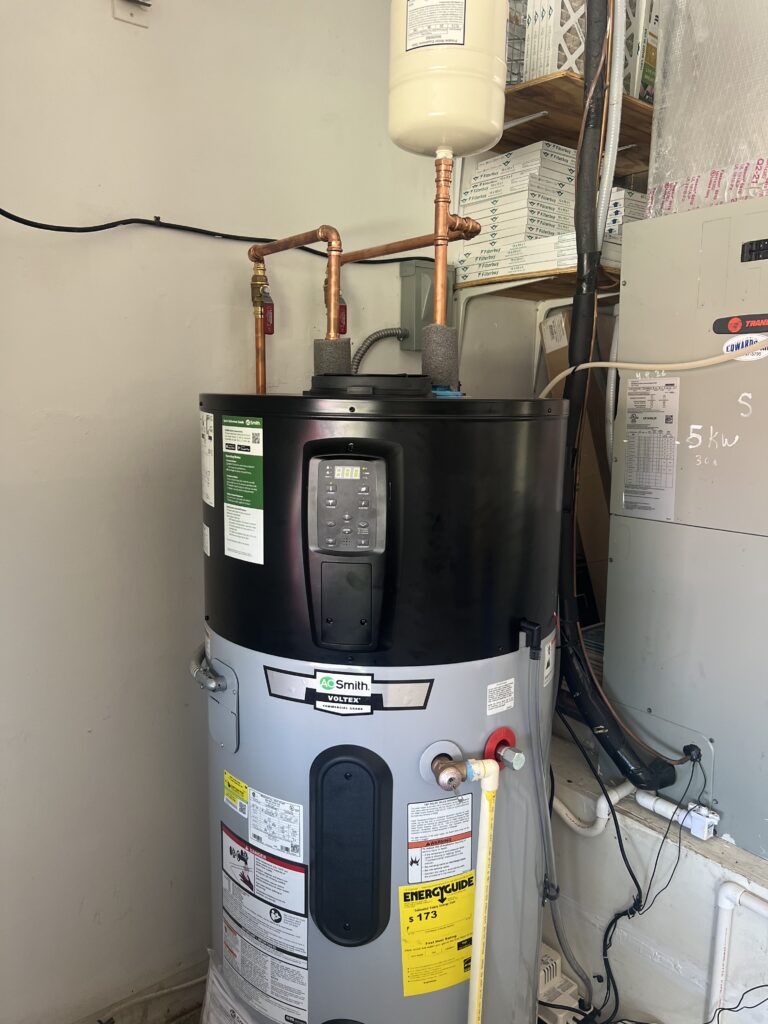 A. O. Smith Voltex hybrid heat pump water heater installed by WHE with copper piping and an expansion tank