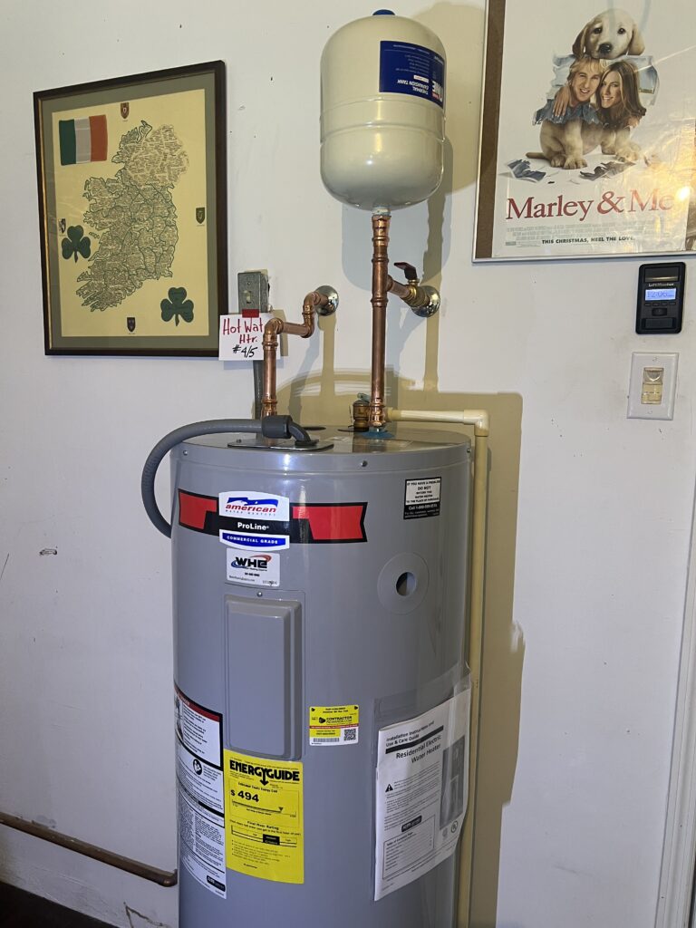 American ProLine electric unit installed by Water Heating Experts with copper connections and an expansion tank