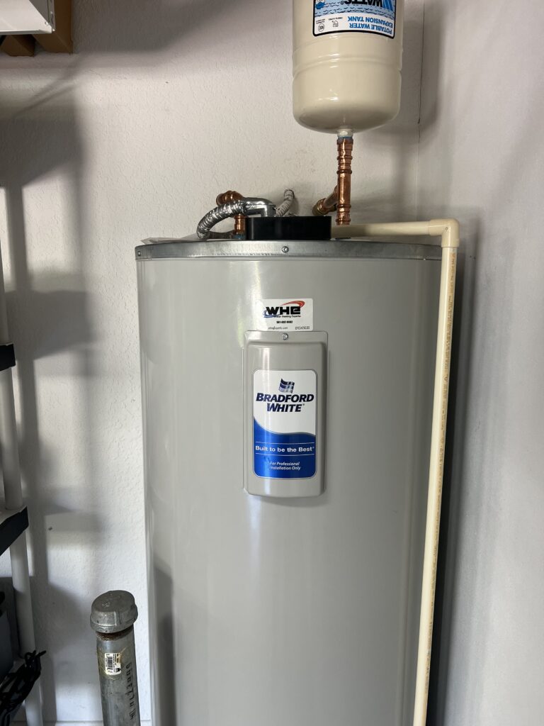 Bradford White electric water heater installed by WHE with copper connections and an expansion tank