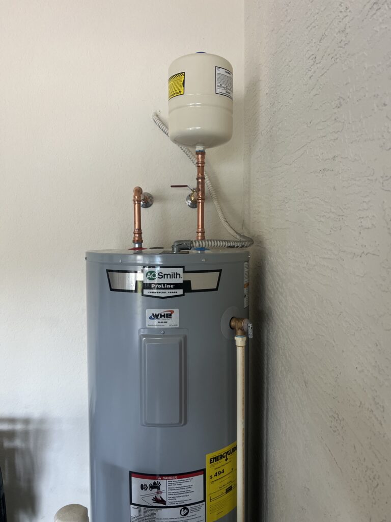 WHE A. O. Smith electric hot water heater installation with copper piping and an expansion tank