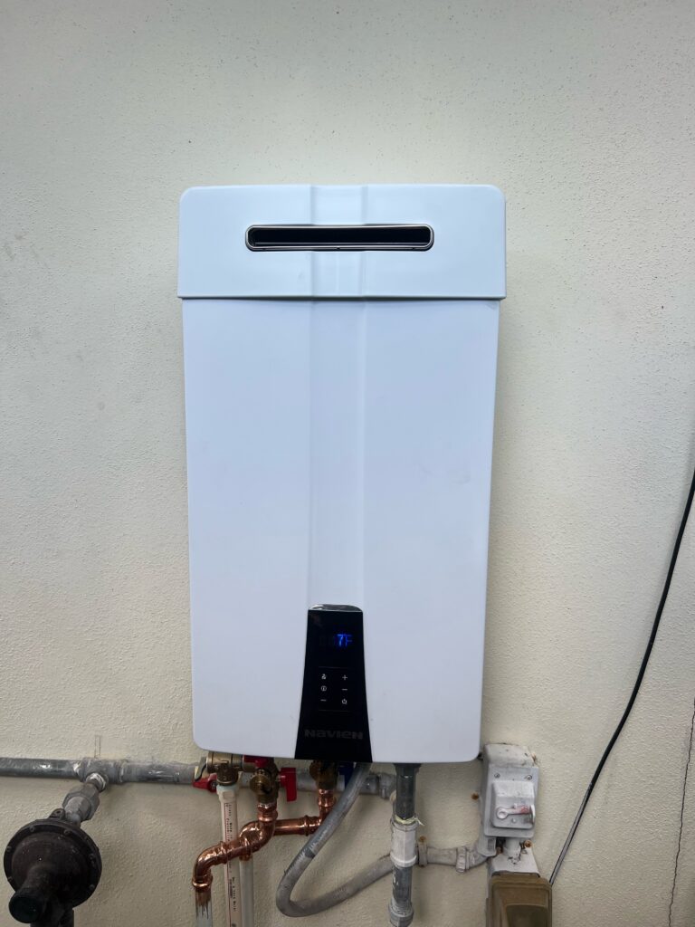 Navien gas tankless unit installed by Water Heating Experts with copper connections and service valves