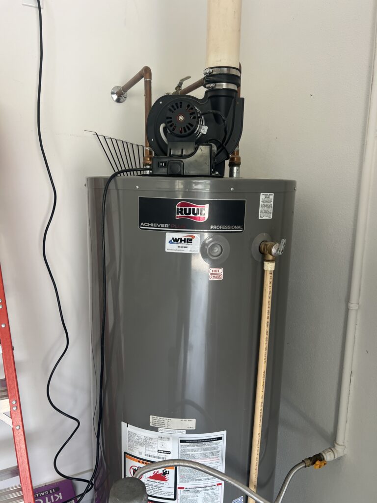 Ruud Achiever Plus power-vent gas water heater with a Water Heating Experts service label
